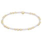 Bracelet with gold beads on a white background