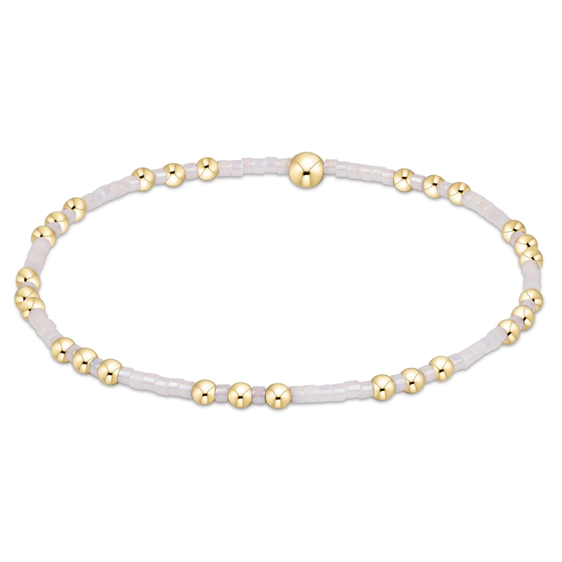 Bracelet with gold beads on a white background
