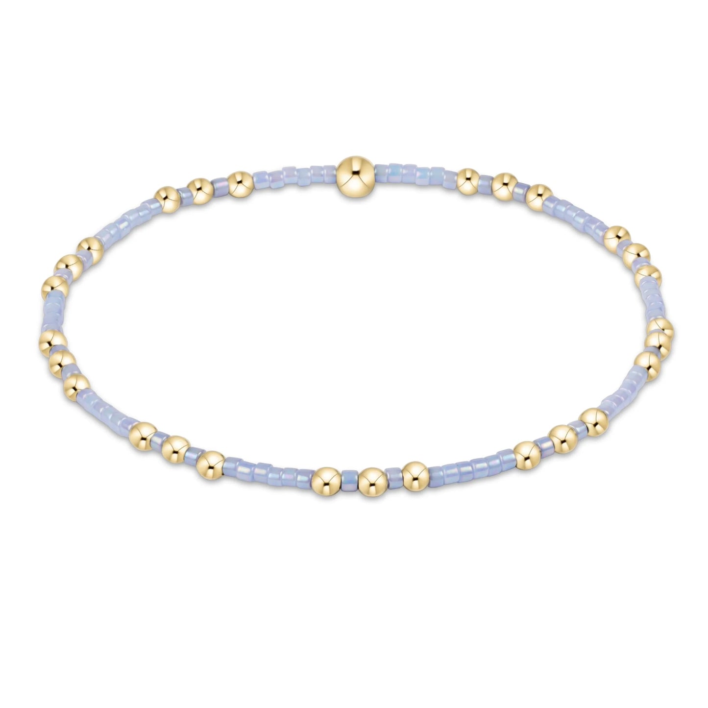 Bracelet with gold and light blue beads on a white background